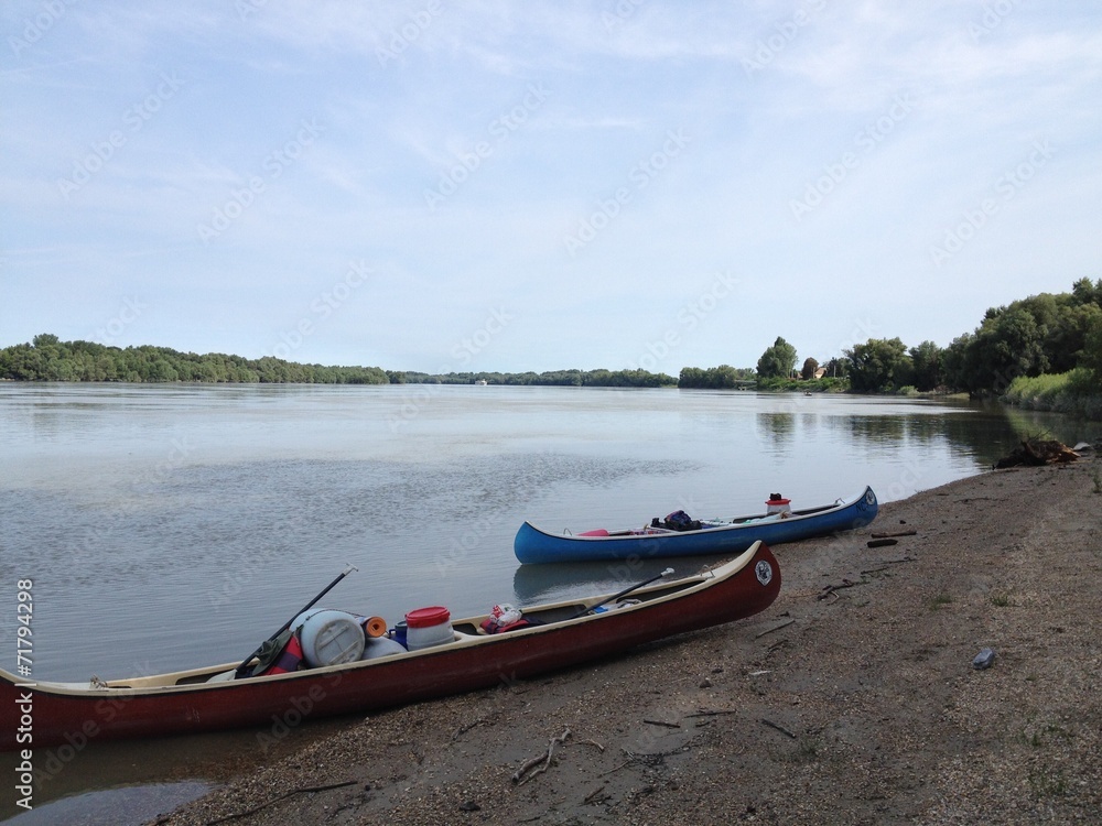 two canoes travel down the danube river