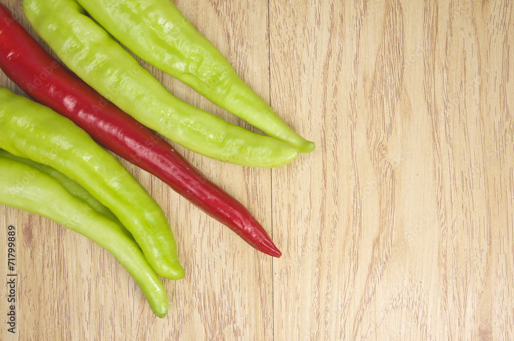 Fresh red and green goat pepper on corner Fresh red and green goat pepper on corner
