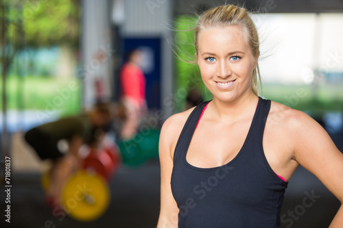 Portrait Of Confident Fit Woman at Cross-Fitness Gym