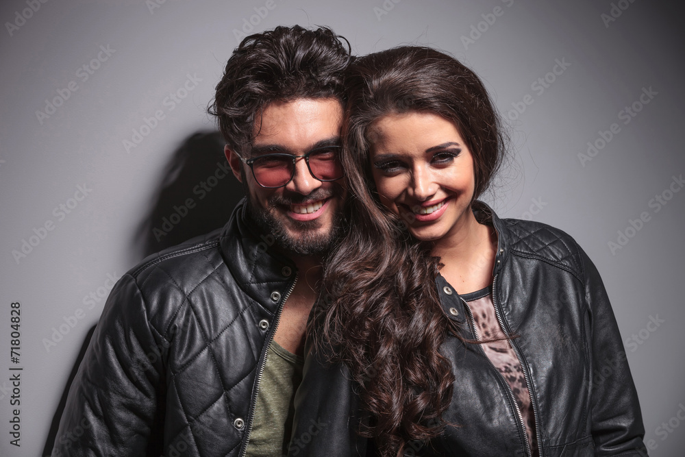 fashion couple smiling for the camera fashion couple smiling for the camera