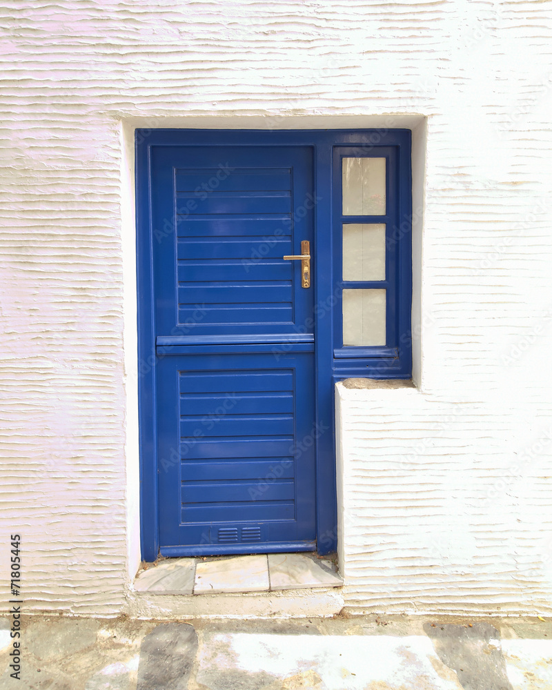 Greek island, blue door on white wall