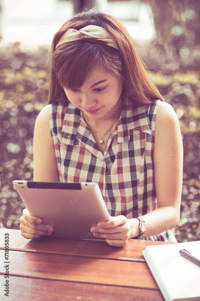 Close Up woman using tablet