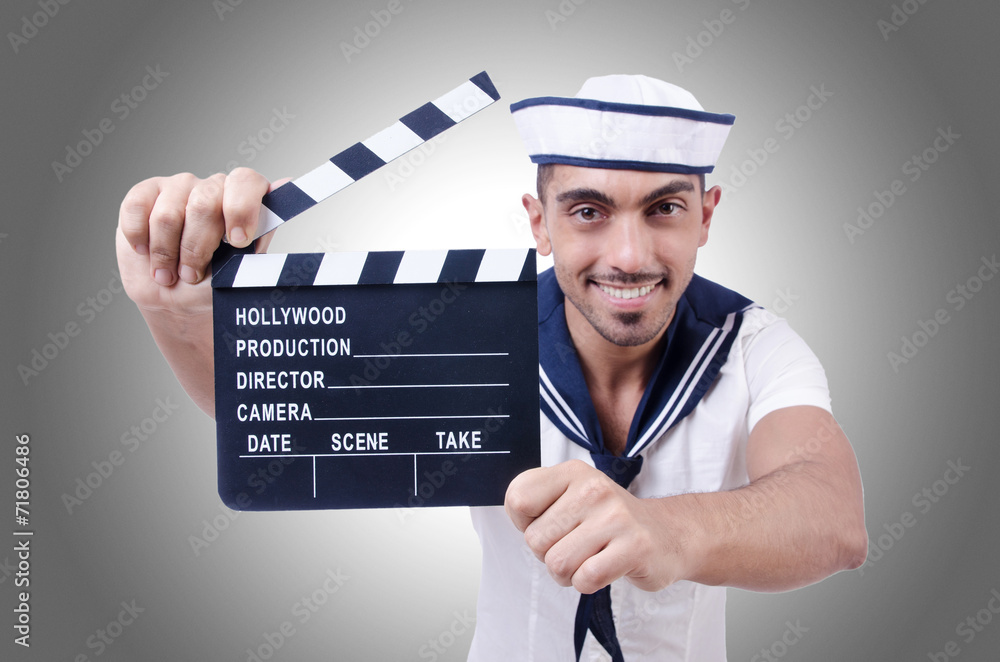 Sailor with movie clapper on white Sailor with movie clapper on white