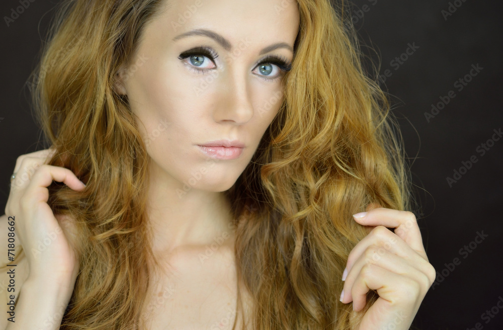 Fototapeta premium Beautiful woman with curly hair