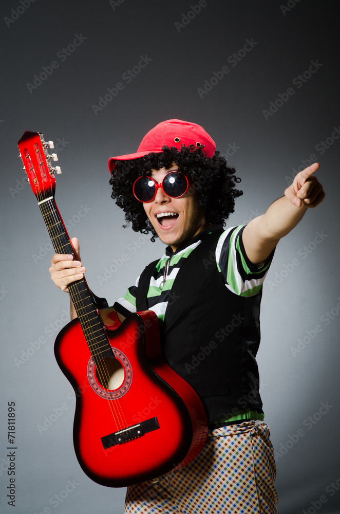Fototapeta premium man with funny haircut and guitar