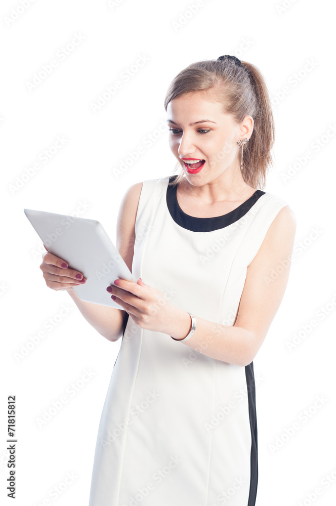 Excited woman holding and looking at tablet. Excited woman holding and looking at tablet.