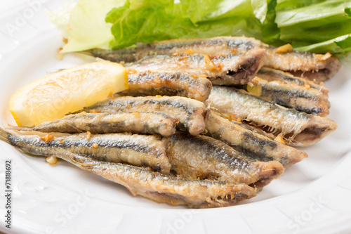 Fried anchovies with salad