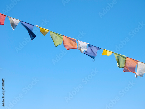 Konstfotografi Colorful prayer flags over a clear blue sky in Sikkim, India