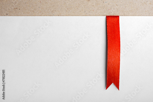 Red bookmark on empty sheet of paper