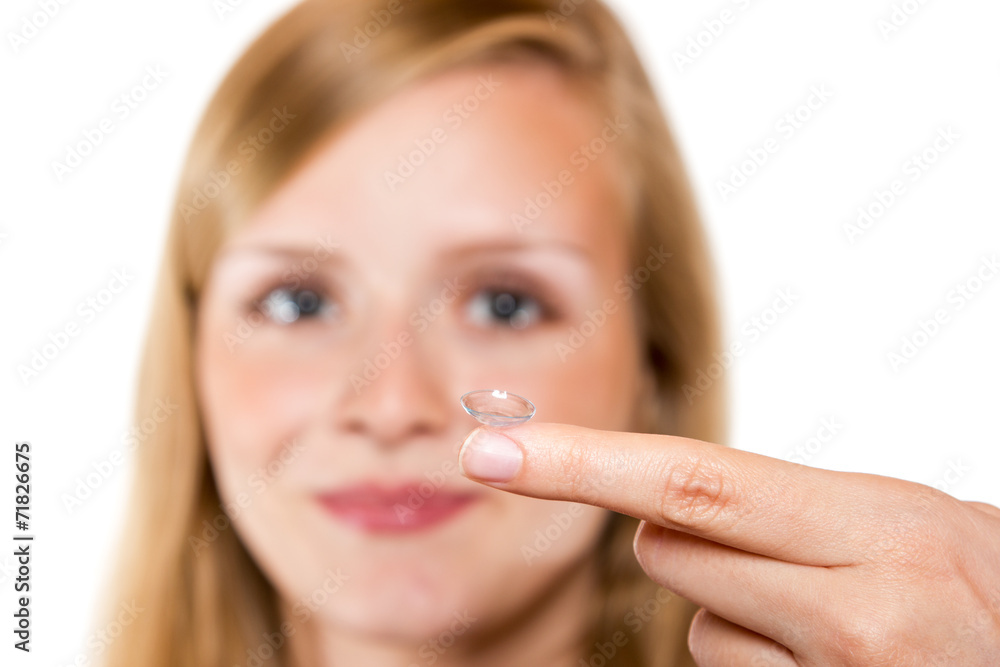 Close-up of blue woman eye with contact lens applying Close-up of blue woman eye with contact lens applying