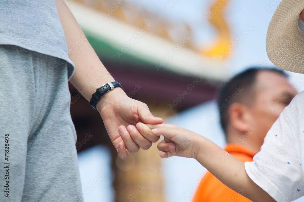 hand of father and son