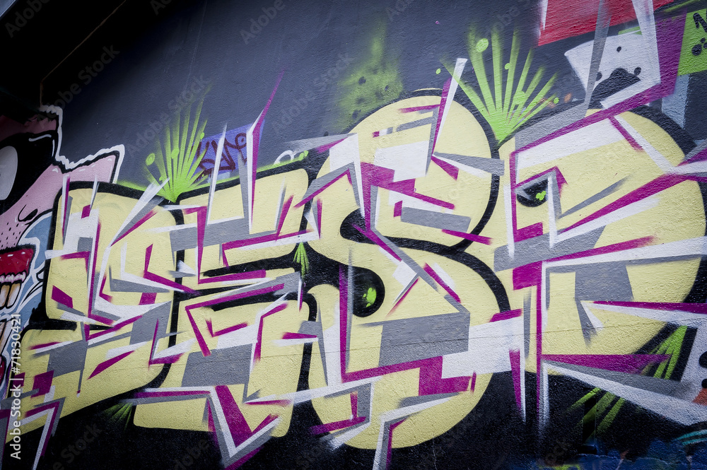 Naklejka premium Mur de graffiti lettres