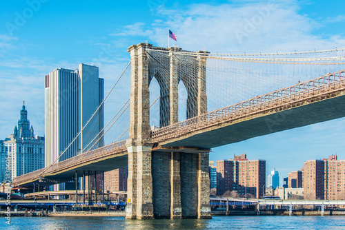Part of famous Brooklyn bridge on bright day photo