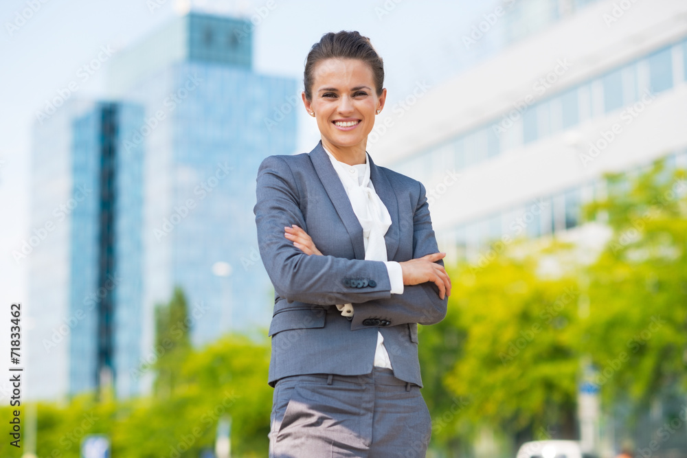 Portrait of happy business woman in office district Portrait of happy business woman in office district
