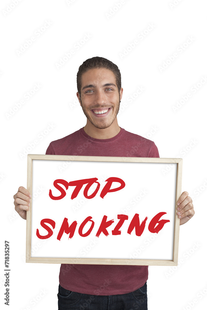happy young man showing board with text: Stop smoking campaign happy young man showing board with text: Stop smoking campaign