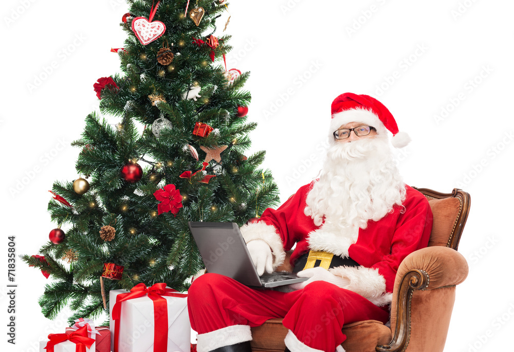 man in costume of santa claus with laptop man in costume of santa claus with laptop