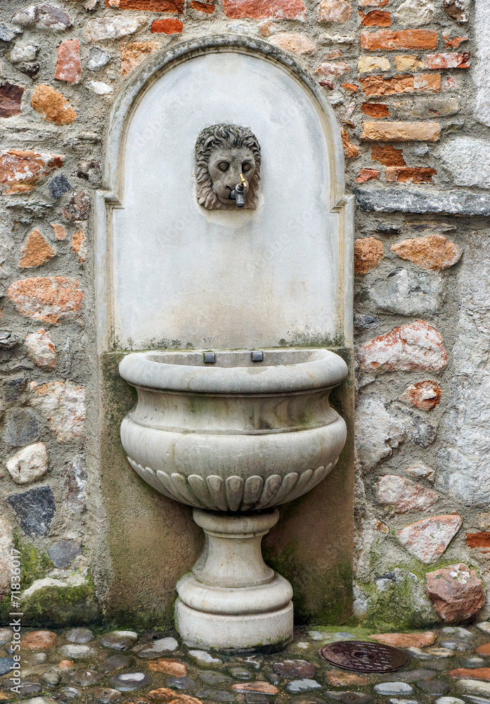 Old Well on Stone Wall Old Well on Stone Wall