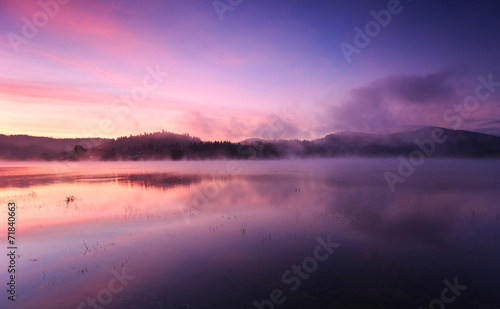 Fog at dawn over the lake in the Bieszczady Mountains © fotorince