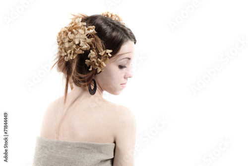 young woman in rural style with flax and dried flowers