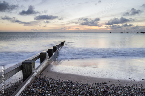 seascape with groin and stones in Swanage bay photo