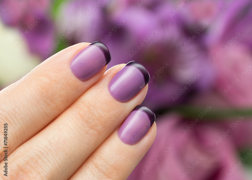 Beautiful manicure, polish is a violet color. Beautiful manicure, polish is a violet color.