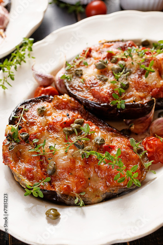 Grilled eggplant stuffed tomatoes  cheese and herbs