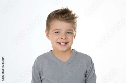 blond cheerful kid on isolated background