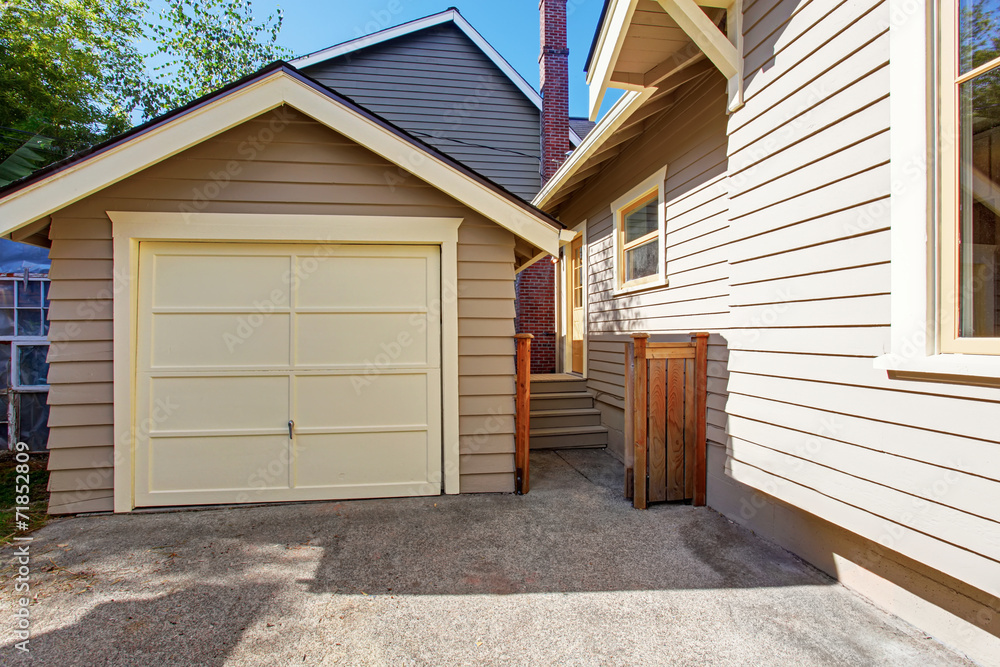 House and garage in clapboard siding trim House and garage in clapboard siding trim