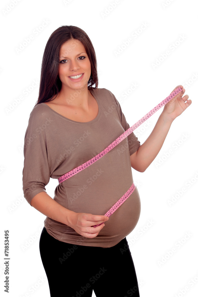 Pregnant woman measuring her belly Pregnant woman measuring her belly