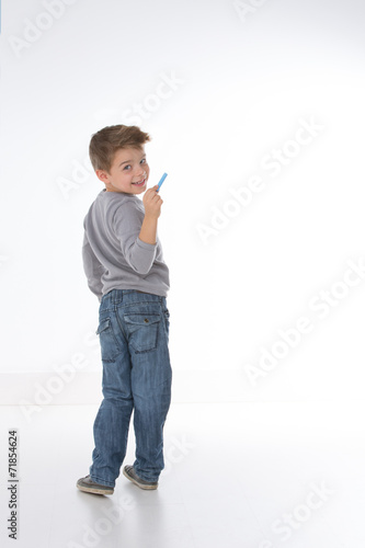 sly child smiling to the camera