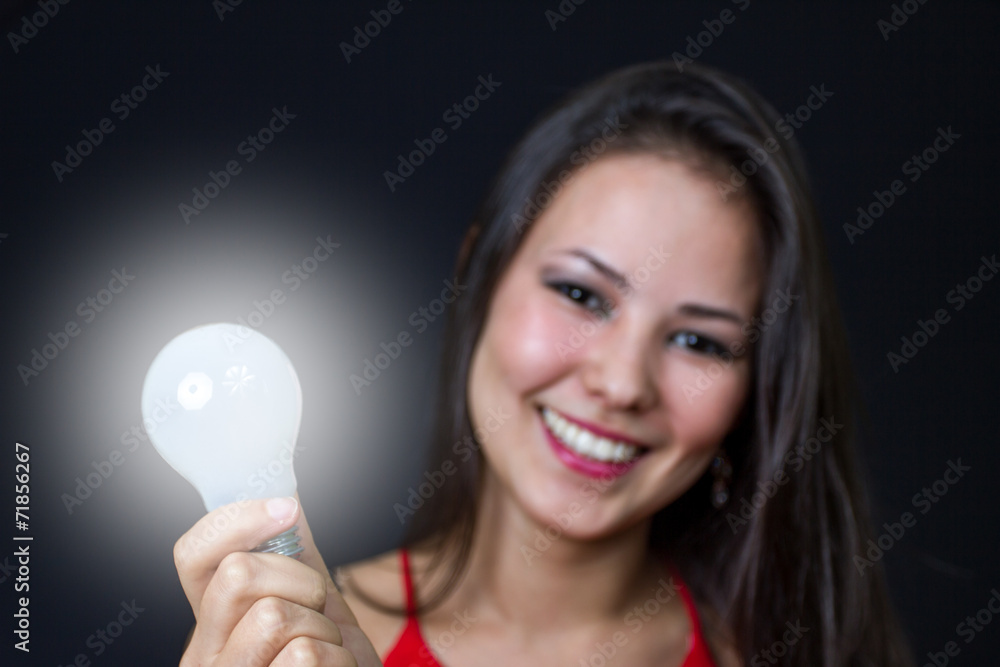 young girl with a bright idea light bulb