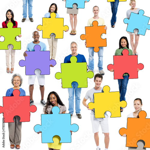 Group of People Holding Jigsaw Puzzle Piece