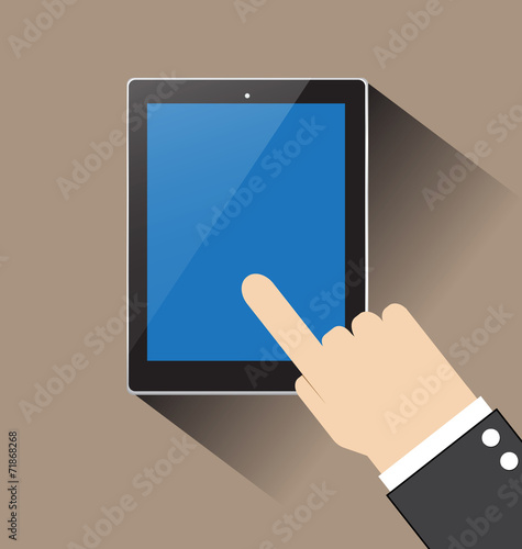 hand of businessman touching on blank blue screen tablecomputer photo