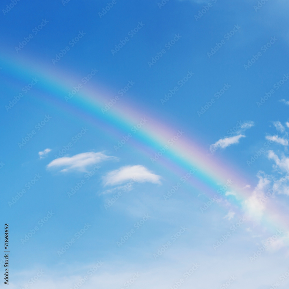 beautiful colorful rainbow on blue sky background beautiful colorful rainbow on blue sky background
