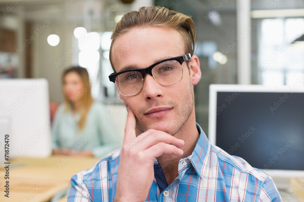 Serious male photo editor in office Serious male photo editor in office