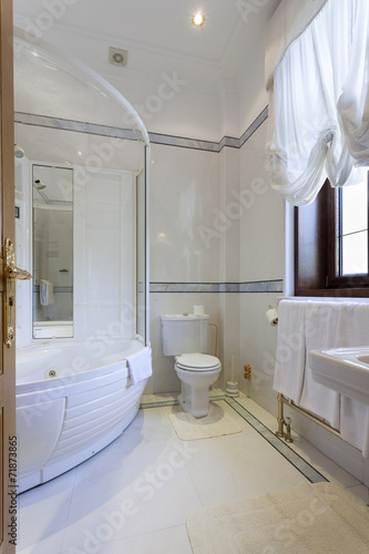 Interior of a luxury bathroom with jacuzzi bath