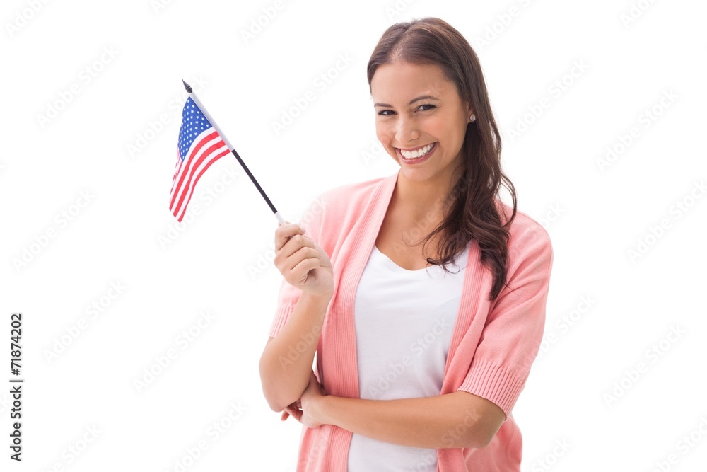 Pretty brunette smiling and holding american flag Pretty brunette smiling and holding american flag