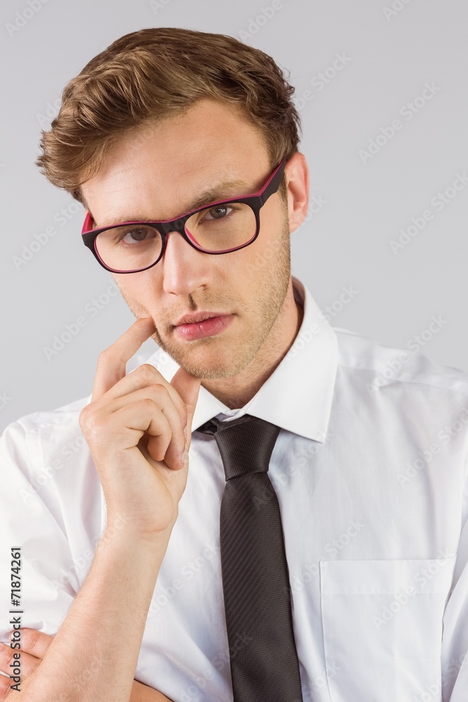 Young businessman thinking looking at camera Young businessman thinking looking at camera