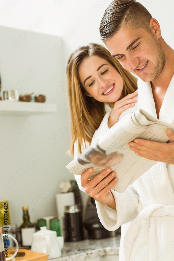 Cute couple in their bathrobes at breakfast Cute couple in their bathrobes at breakfast