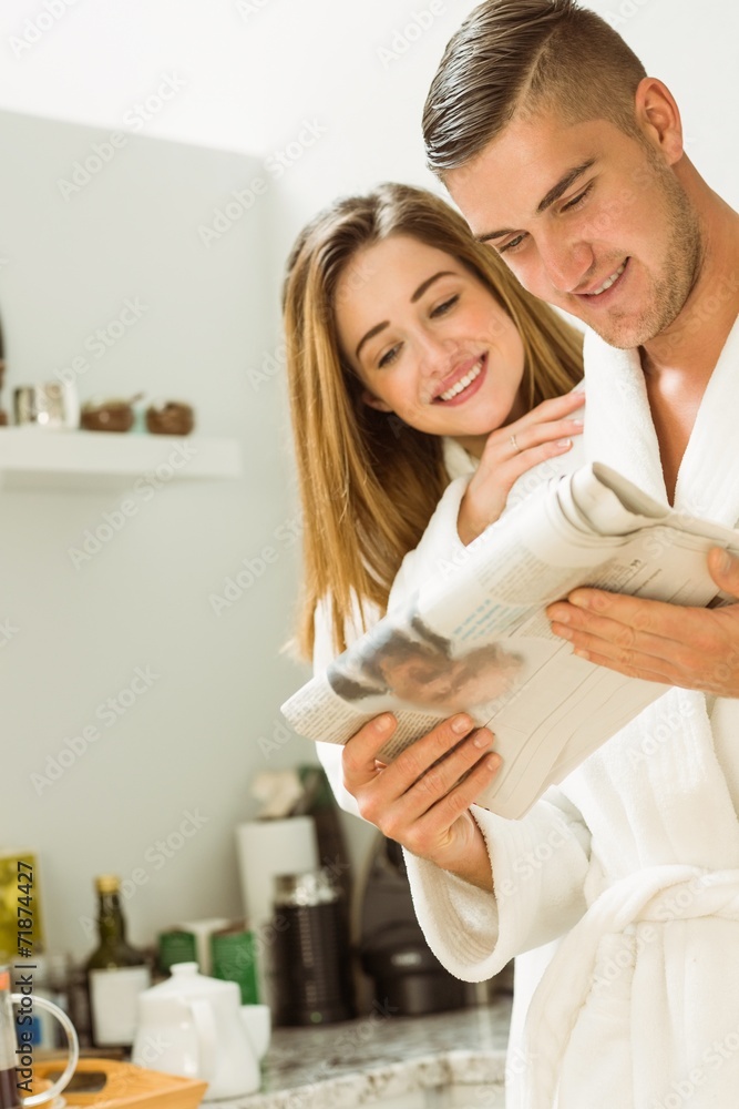 Cute couple in their bathrobes at breakfast