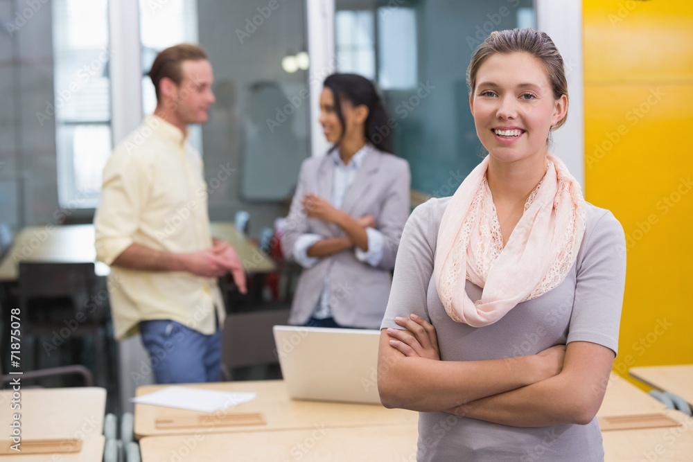 Smiling businesswoman with colleagues in office Smiling businesswoman with colleagues in office