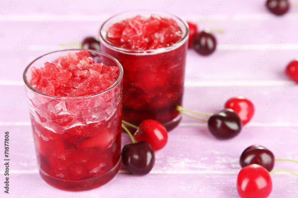 Closeup of cherry granita in glasses, on color wooden Closeup of cherry granita in glasses, on color wooden