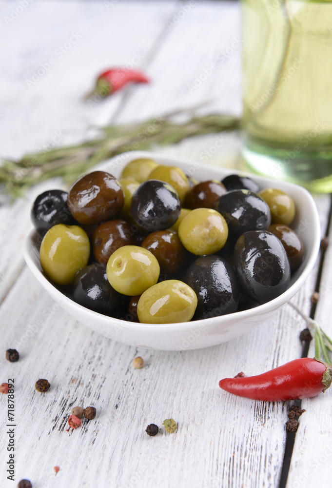 Different marinated olives on table close-up Different marinated olives on table close-up
