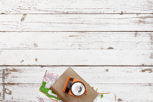 empty white wooden table with tools for adventure, top view