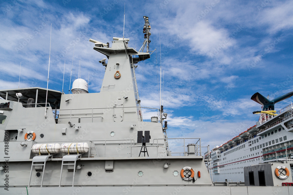 Fototapeta premium Naval Boat by Cruise Ship