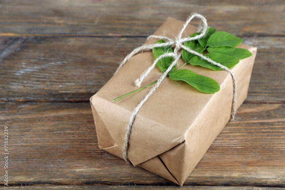 Natural style handcrafted gift box with fresh leaves and rustic Natural style handcrafted gift box with fresh leaves and rustic