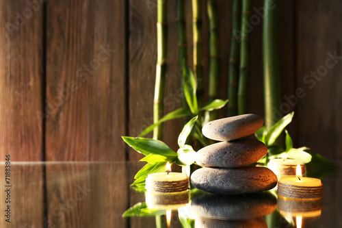 Spa stones  candles and bamboo branches