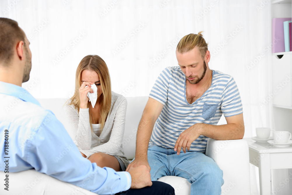 Young couple with problem on reception for family psychologist Young couple with problem on reception for family psychologist
