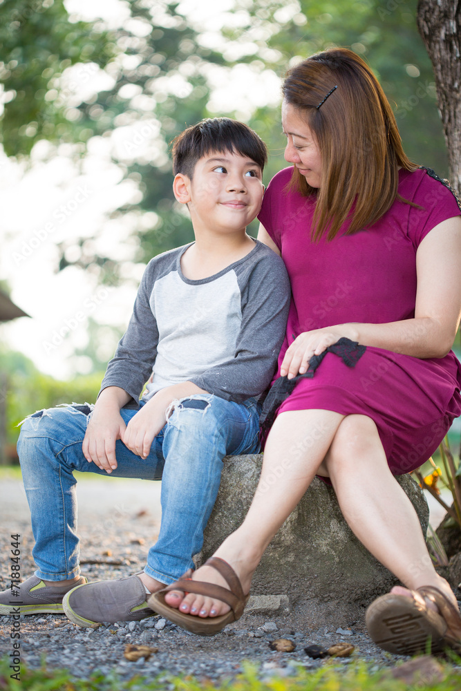 Happy Asian family ,mother with her son at park Happy Asian family ,mother with her son at park
