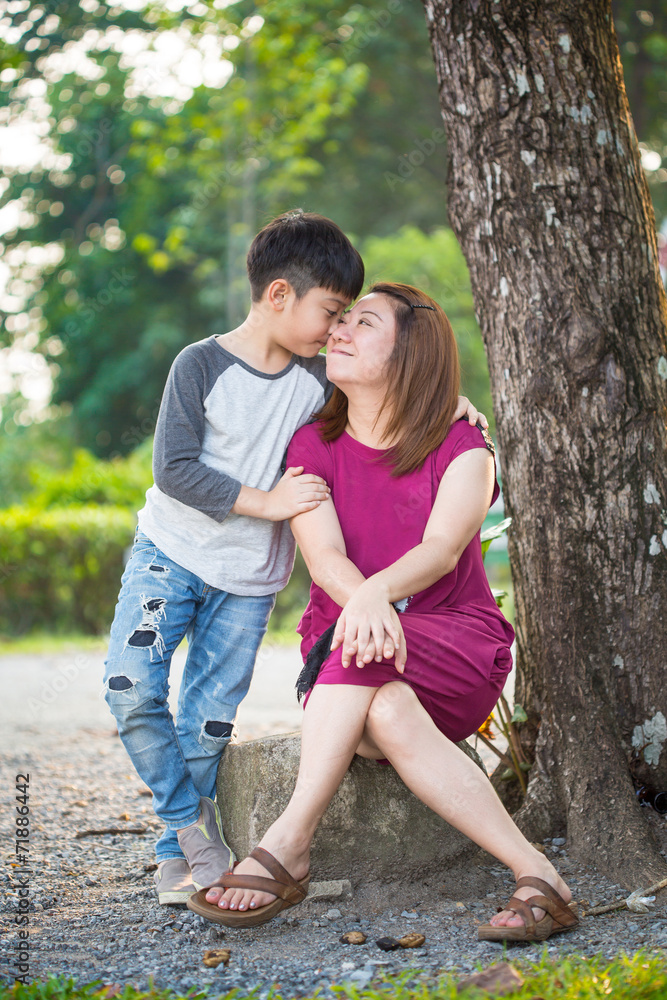 Happy Asian family ,mother with her son at park Happy Asian family ,mother with her son at park